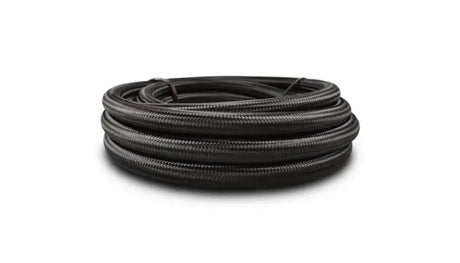Coiled black nylon braided flexible hose with PTFE liner for high-performance use