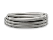 Coiled gray vibrant SS braided flex hose with PTFE liner for easy fitting
