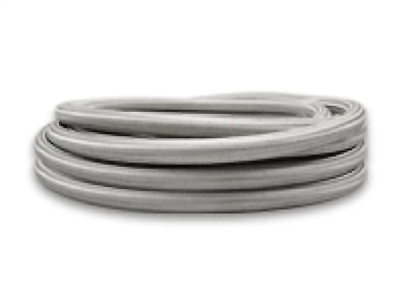 Coiled gray vibrant SS braided flex hose with PTFE liner for easy fitting