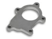 Metal adapter plate with bolt holes.