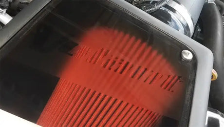 Red air filter inside black box for Toyota Tacoma air intake DryTech closed box system