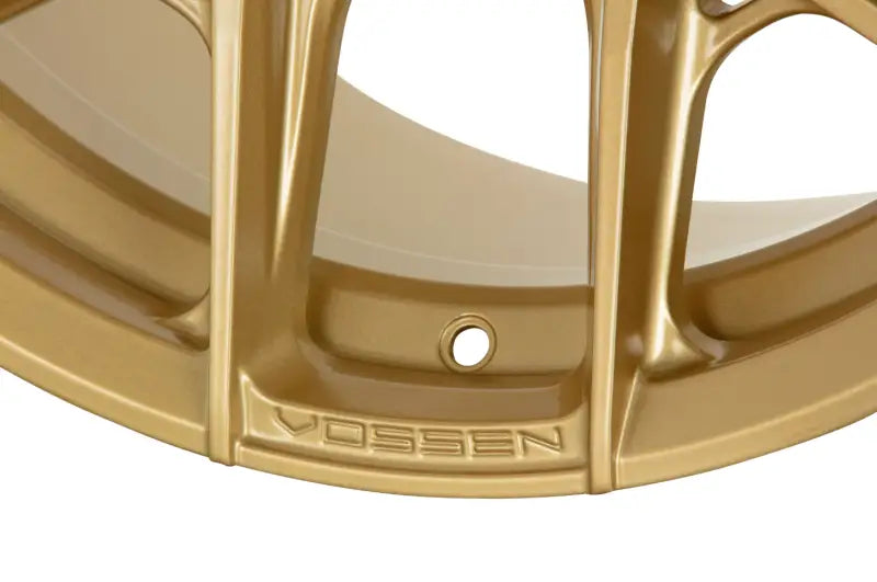 Glossy Vossen HF6-4 satin gold wheel with intricate design