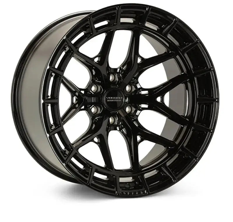 Gloss black Vossen HFX-1 wheel on black car, stylish and glossy finish