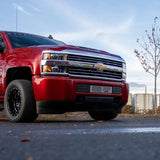 Red Chevrolet Silverado pickup truck with Wehrli LML L5P Duramax bumper grille