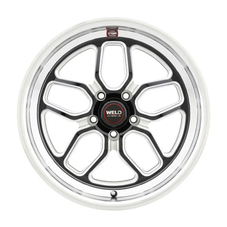 Chrome and black five-spoke wheel.