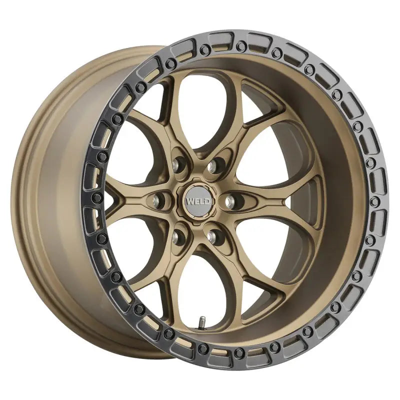 Bronze-colored car wheel with a silver-colored rim.