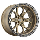 Bronze-colored car wheel with a silver-colored rim.