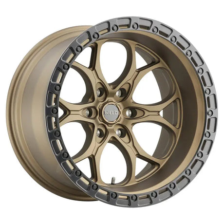 Bronze-colored car wheel with a silver-colored rim.
