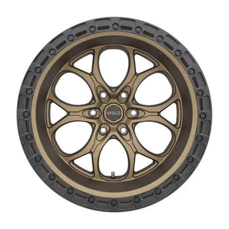 Bronze-colored wheel with a dark gray rim.