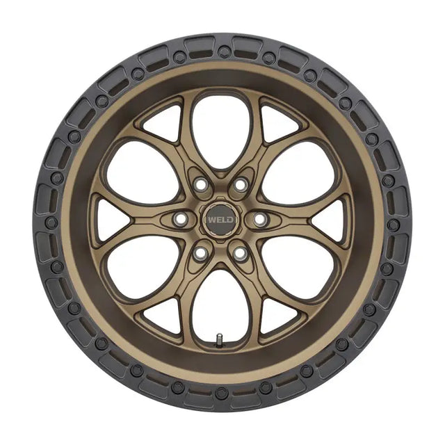 Bronze-colored wheel with a dark gray rim.