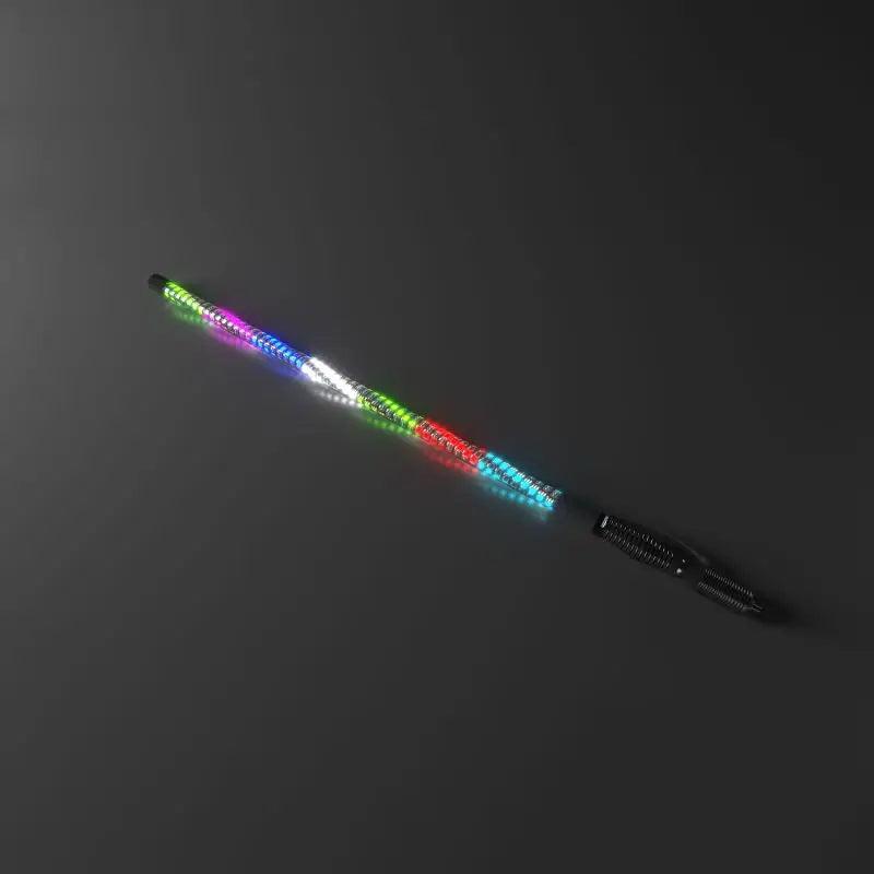 Black light-up fidget spinner pen with colorful LEDs on Whip It 5Ft Magnet Base