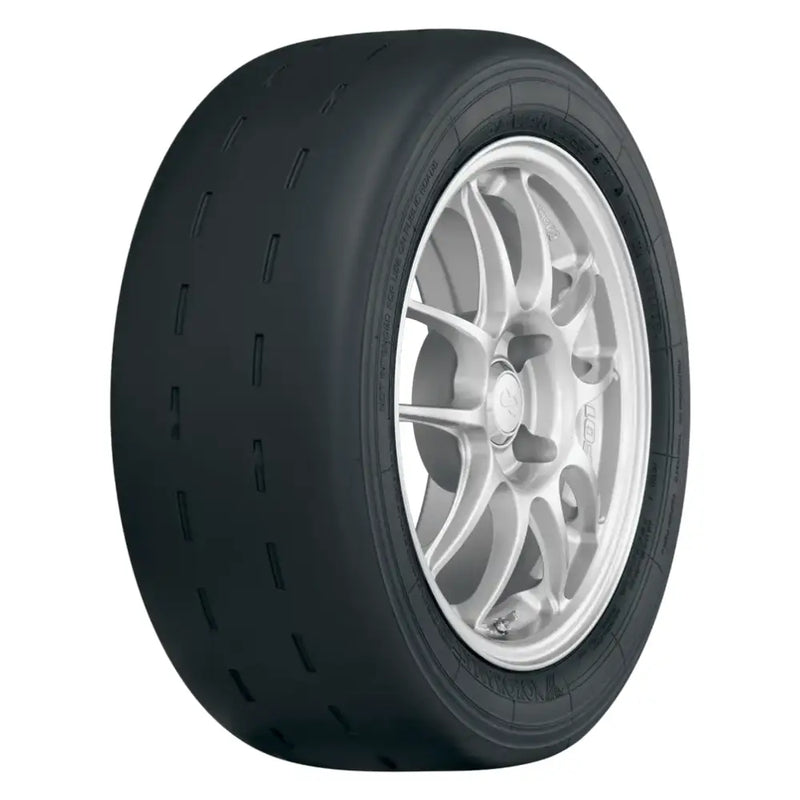 Black racing slick tire with silver multi-spoke wheel on Yokohama Advan A055 tire