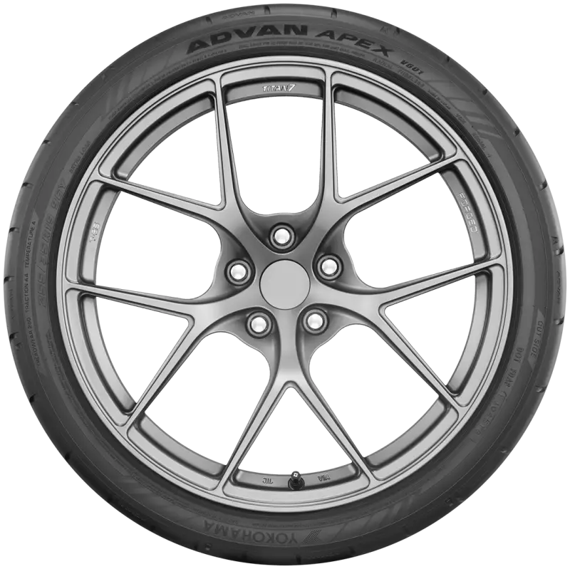 Gray car tire with silver rim showcasing Yokohama Advan Apex V601 tire design