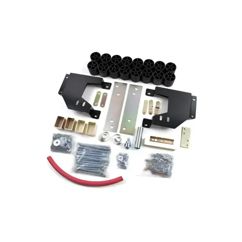 Zone Offroad 99-04 Ford F-250/350 2.5in Box Kit components laid out on a white surface, including brackets, spacers, hardware, and hose.